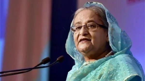 Sheikh Hasina speaking at a podium